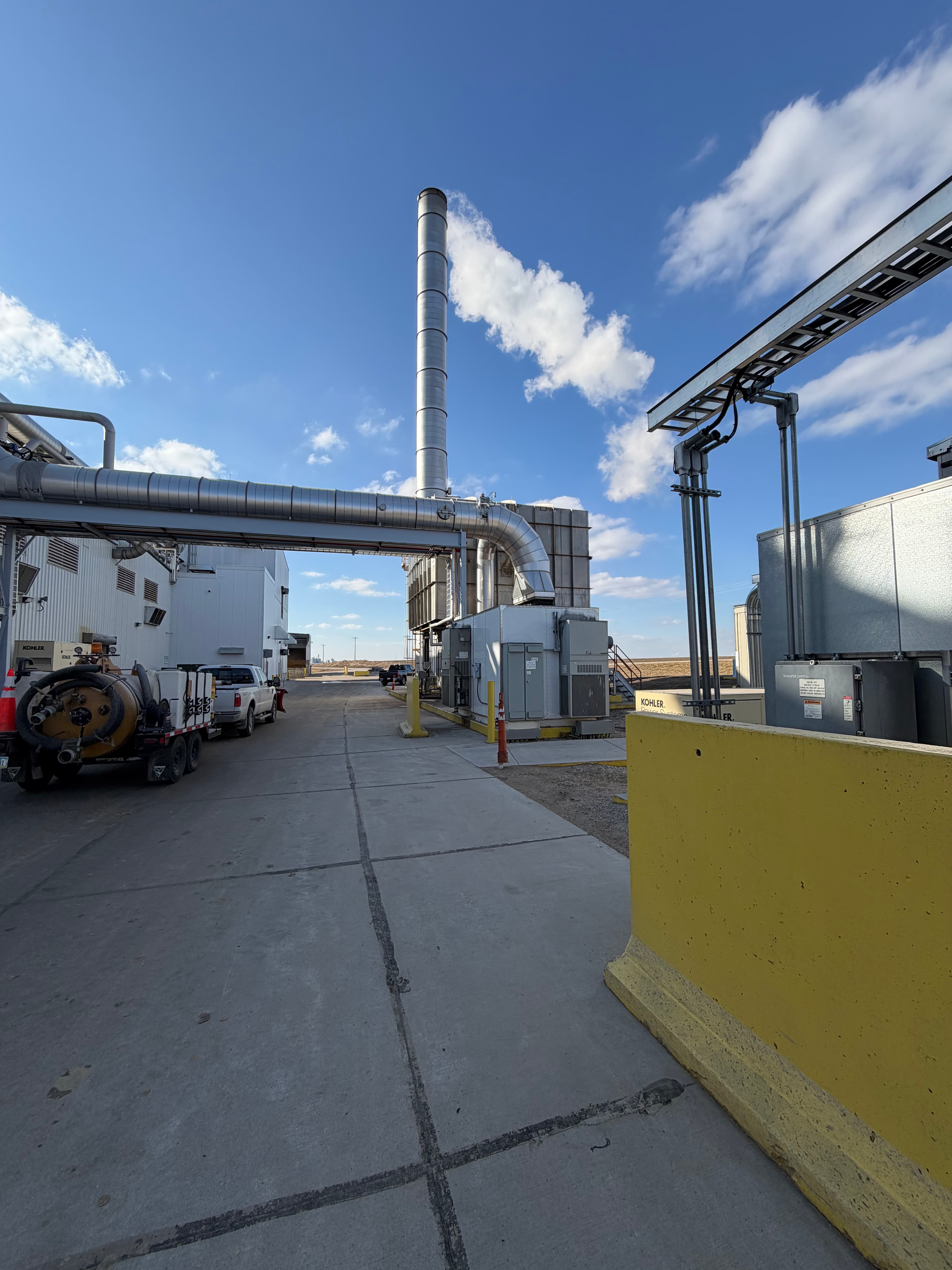 Industrial kiln with vertical stack and spiral staircase access