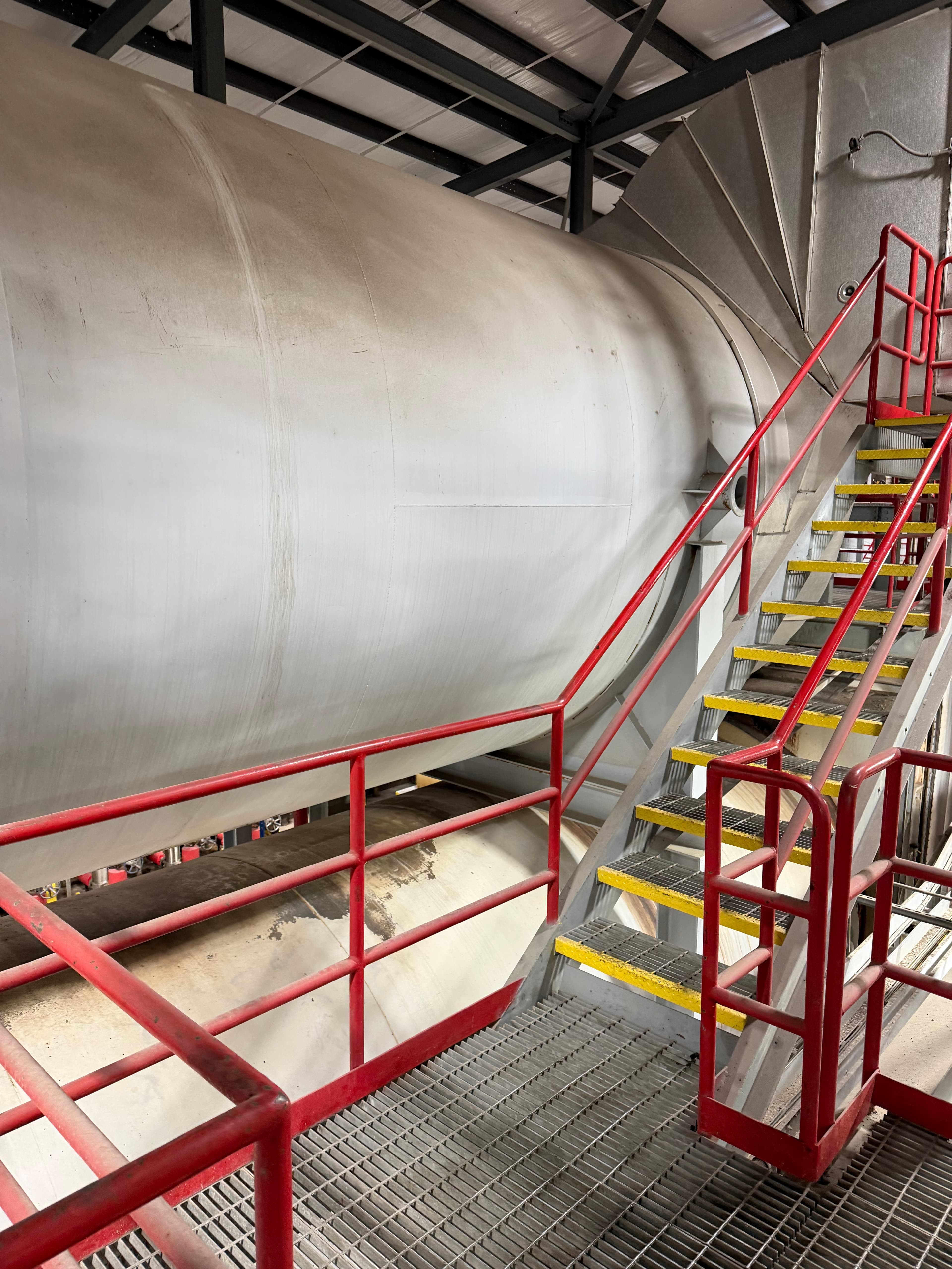 Industrial drum dryer showing trunnion assembly and rotating cylinder